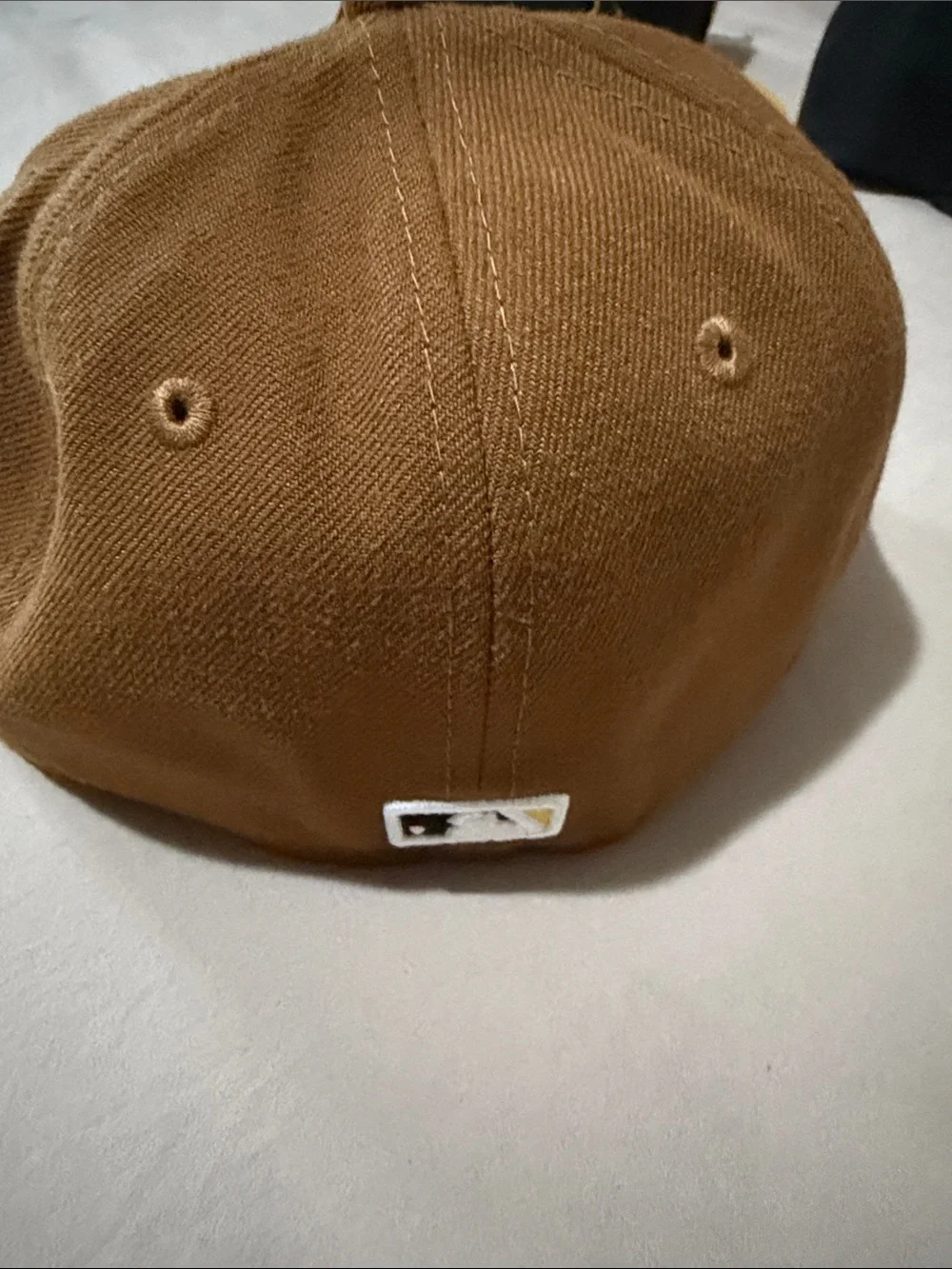 Brown and Black Baseball Cap with Yellow-Outlined 'P' Patch
